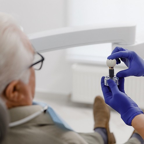 New Baltimore patient learning about dental implant options